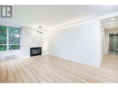 204 8280 Westminster Highway, Richmond, BC - Indoor Photo Showing Living Room With Fireplace