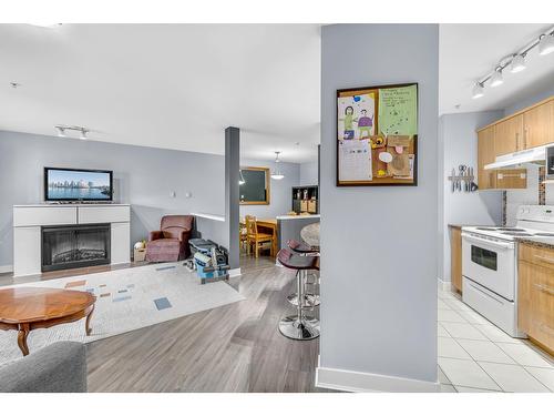 311 19366 65 Street, Surrey, BC - Indoor Photo Showing Kitchen With Fireplace