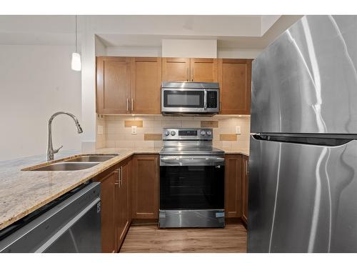 217 13468 King George Boulevard, Surrey, BC - Indoor Photo Showing Kitchen With Double Sink