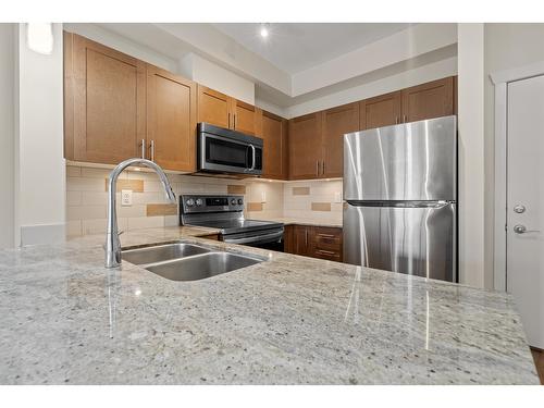 217 13468 King George Boulevard, Surrey, BC - Indoor Photo Showing Kitchen With Double Sink