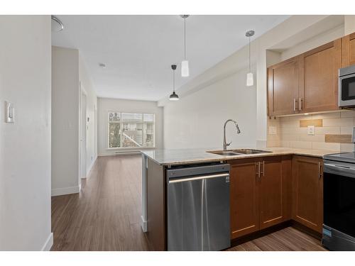 217 13468 King George Boulevard, Surrey, BC - Indoor Photo Showing Kitchen With Double Sink