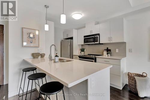 103 - 17 Kay Crescent, Guelph (Guelph South), ON - Indoor Photo Showing Kitchen With Stainless Steel Kitchen With Double Sink With Upgraded Kitchen