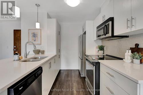 103 - 17 Kay Crescent, Guelph (Guelph South), ON - Indoor Photo Showing Kitchen With Stainless Steel Kitchen With Double Sink With Upgraded Kitchen