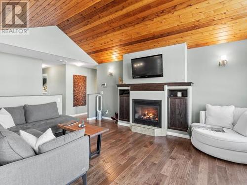 76 Aksala Drive, Whitehorse, YT - Indoor Photo Showing Living Room With Fireplace