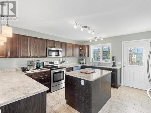 76 Aksala Drive, Whitehorse, YT - Indoor Photo Showing Kitchen With Double Sink With Upgraded Kitchen