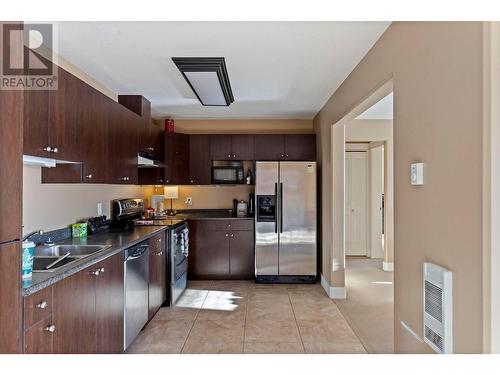 3rd level kitchen - 1347 Wilmot Avenue, Kelowna, BC - Indoor Photo Showing Kitchen With Double Sink