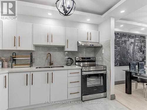 1206 - 2550 Pharmacy Avenue, Toronto, ON - Indoor Photo Showing Kitchen With Double Sink With Upgraded Kitchen