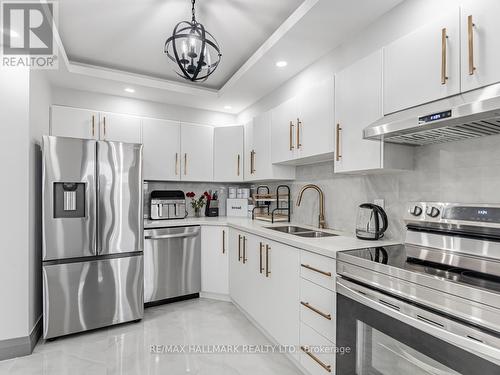 1206 - 2550 Pharmacy Avenue, Toronto, ON - Indoor Photo Showing Kitchen With Stainless Steel Kitchen With Double Sink With Upgraded Kitchen