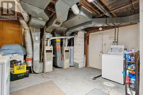 Lower suite: common laundry/furnace/storage room - 1511 Child Avenue Ne, Calgary, AB - Indoor Photo Showing Laundry Room