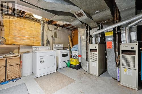 Lower suite: common laundy/furnace/storage room - 1511 Child Avenue Ne, Calgary, AB - Indoor Photo Showing Laundry Room