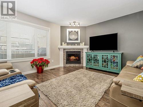 Living Room - 39 Moonlight Boulevard W, Lethbridge, AB - Indoor Photo Showing Living Room With Fireplace