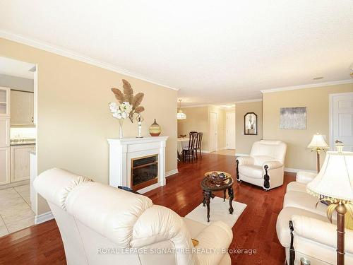 1705-35 Kingsbridge Garden Circ, Mississauga, ON - Indoor Photo Showing Living Room With Fireplace