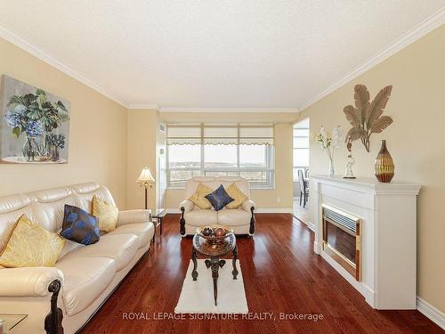 1705-35 Kingsbridge Garden Circ, Mississauga, ON - Indoor Photo Showing Living Room With Fireplace