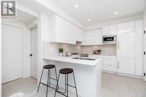 406 5399 Joyce Street, Vancouver, BC - Indoor Photo Showing Kitchen With Double Sink