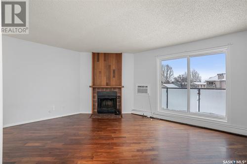 303 855 Wollaston Crescent, Saskatoon, SK - Indoor Photo Showing Living Room With Fireplace