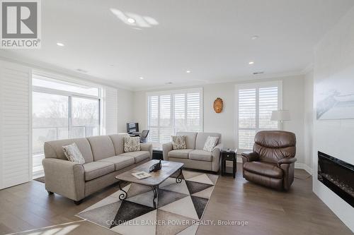 404 - 460 Callaway Road, London, ON - Indoor Photo Showing Living Room With Fireplace