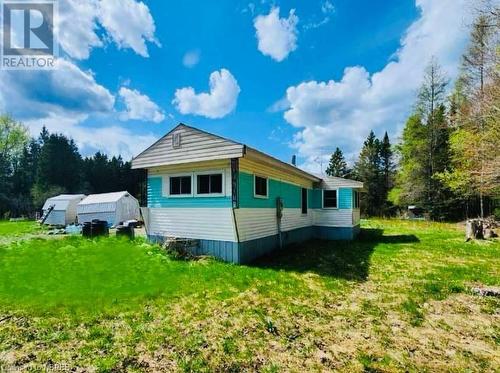 View of side of home with an outbuilding and a yard - 526 Star Lake Road, Emsdale, ON - Outdoor