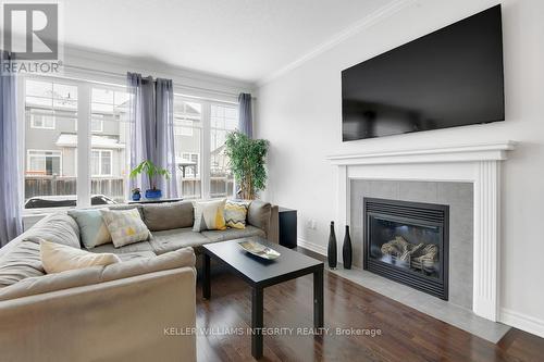 700 Hazelnut Crescent, Ottawa, ON - Indoor Photo Showing Living Room With Fireplace