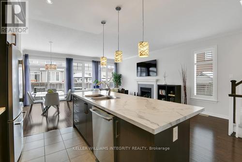 700 Hazelnut Crescent, Ottawa, ON - Indoor Photo Showing Kitchen With Fireplace With Double Sink With Upgraded Kitchen