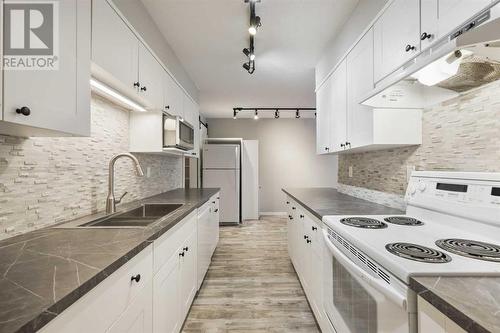 3513 43 Street Sw, Calgary, AB - Indoor Photo Showing Kitchen With Double Sink