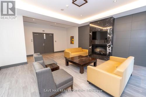 2908 - 4070 Confederation Parkway, Mississauga, ON - Indoor Photo Showing Living Room With Fireplace