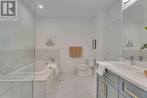 Glass shower and double sinks - 716 - 480 Callaway Road S, London, ON - Indoor Photo Showing Bathroom