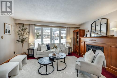 12 Strike Avenue, Clarington (Bowmanville), ON - Indoor Photo Showing Living Room With Fireplace