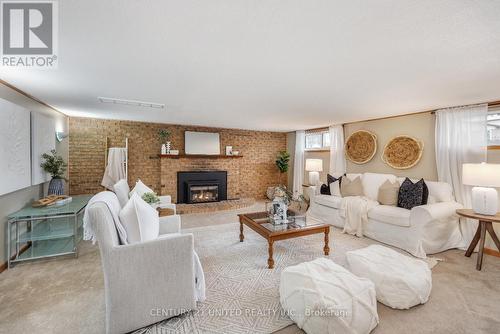 12 Strike Avenue, Clarington (Bowmanville), ON - Indoor Photo Showing Living Room With Fireplace