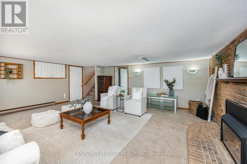 12 Strike Avenue, Clarington (Bowmanville), ON - Indoor Photo Showing Other Room With Fireplace