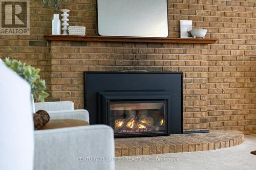 12 Strike Avenue, Clarington (Bowmanville), ON - Indoor Photo Showing Living Room With Fireplace