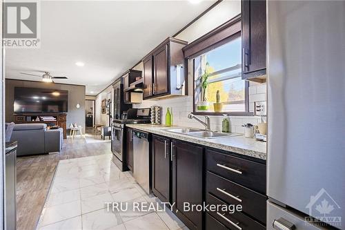 100 - 3535 St. Joseph Boulevard, Ottawa, ON - Indoor Photo Showing Kitchen With Double Sink