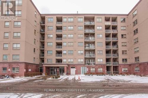 716 - 7405 Goreway Drive, Mississauga, ON - Outdoor With Balcony With Facade