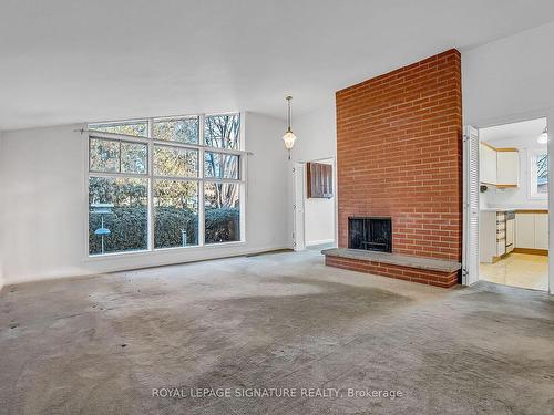 20 Chatfield Dr, Toronto, ON - Indoor Photo Showing Living Room With Fireplace