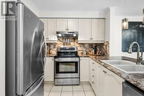 133 - 3333 New Street, Burlington, ON - Indoor Photo Showing Kitchen With Double Sink With Upgraded Kitchen