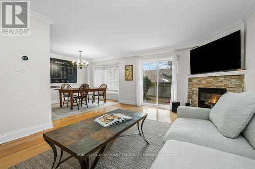 133 - 3333 New Street, Burlington, ON - Indoor Photo Showing Living Room With Fireplace