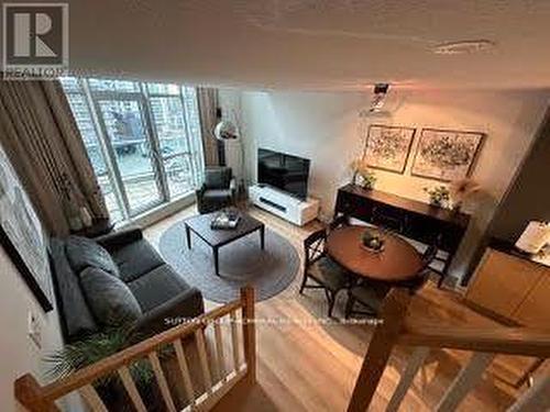 723 - 36 Blue Jays Way, Toronto, ON - Indoor Photo Showing Living Room With Fireplace