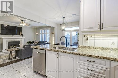 5194 Tydman Way, Burlington, ON - Indoor Photo Showing Kitchen With Fireplace With Double Sink With Upgraded Kitchen