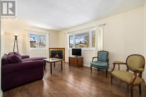 18 Mclean Boulevard, Perth, ON - Indoor Photo Showing Living Room With Fireplace