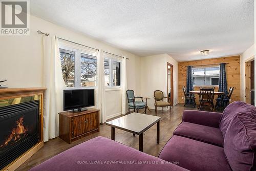 18 Mclean Boulevard, Perth, ON - Indoor Photo Showing Living Room With Fireplace