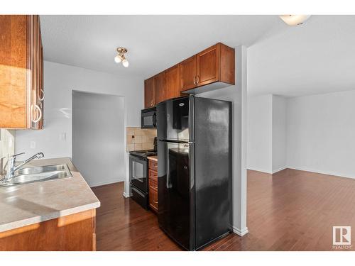 #304 9725 82 Av Nw, Edmonton, AB - Indoor Photo Showing Kitchen With Double Sink