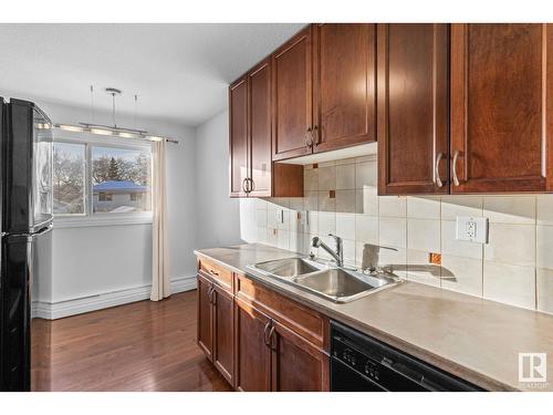 #304 9725 82 Av Nw, Edmonton, AB - Indoor Photo Showing Kitchen With Double Sink