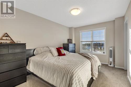 100 Legacy Main Street Se, Calgary, AB - Indoor Photo Showing Bedroom