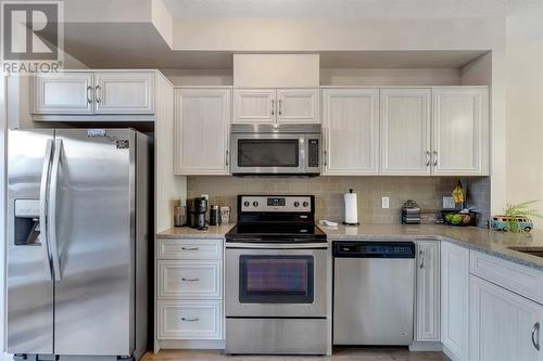 100 Legacy Main Street Se, Calgary, AB - Indoor Photo Showing Kitchen With Upgraded Kitchen