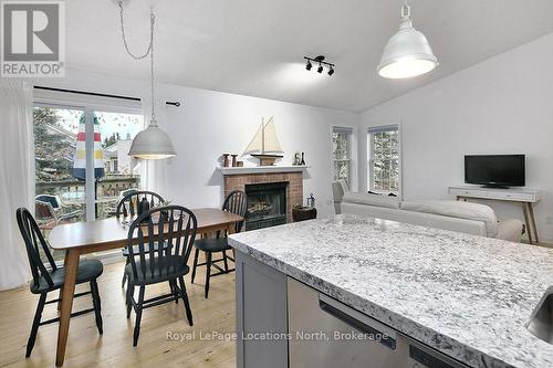 159 - 150 Victoria Street S, Blue Mountains (Thornbury), ON - Indoor Photo Showing Dining Room With Fireplace