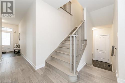 Stairs with hardwood / wood-style flooring - 116 Whithorn Crescent, Caledonia, ON - Indoor Photo Showing Other Room