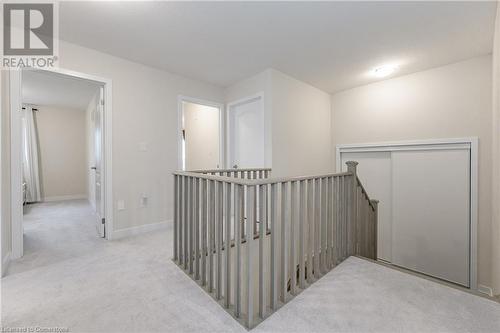 Hall with light colored carpet - 116 Whithorn Crescent, Caledonia, ON - Indoor Photo Showing Other Room