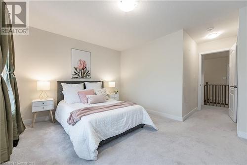 View of carpeted bedroom - 116 Whithorn Crescent, Caledonia, ON - Indoor Photo Showing Bedroom