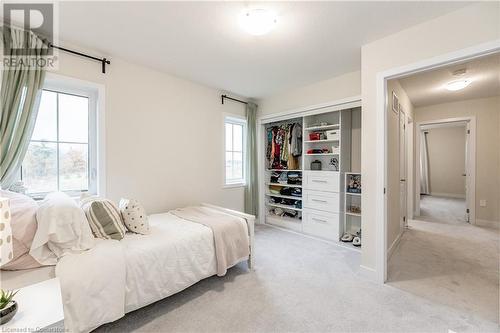 Bedroom with a closet and light colored carpet - 116 Whithorn Crescent, Caledonia, ON - Indoor Photo Showing Bedroom