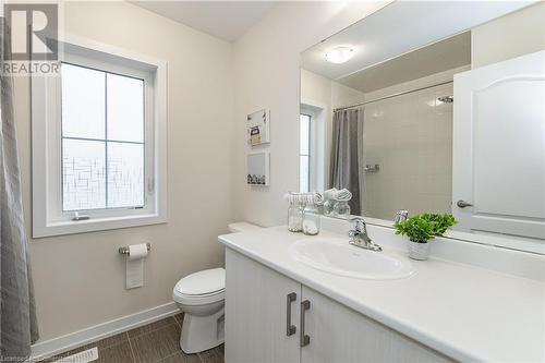 Bathroom with walk in shower, tile patterned flooring, vanity, and toilet - 116 Whithorn Crescent, Caledonia, ON - Indoor Photo Showing Bathroom