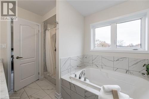 Bathroom featuring independent shower and bath - 116 Whithorn Crescent, Caledonia, ON - Indoor Photo Showing Bathroom